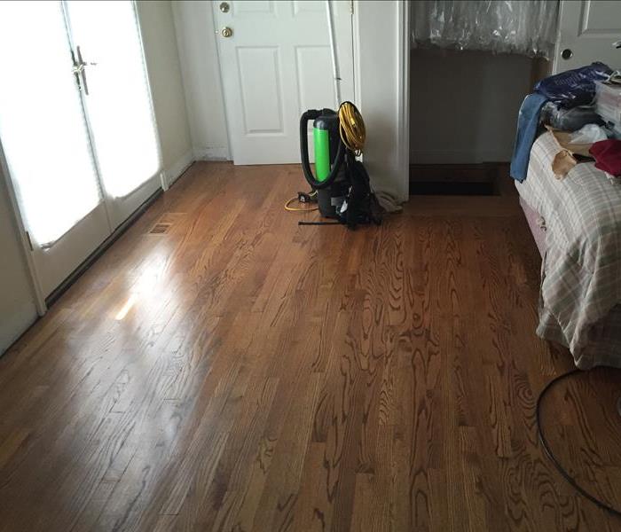 Image shows all the drying equipment removed and the Hardwood Floors saved
