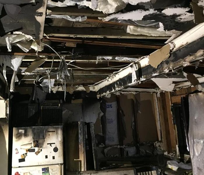 Image shows badly burnt kitchen structure caused by a counter top appliance
