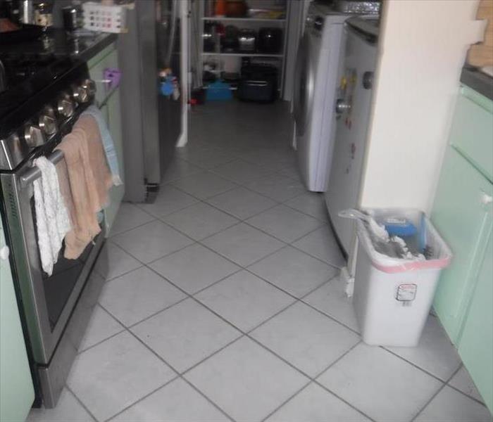 Tile Flooring in a Kitchen affected by a Water Loss